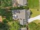 Aerial view of the house, backyard and driveway surrounded by mature trees and landscaping at 2461 Fernleaf Nw Ct, Atlanta, GA 30318