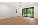 Bright room features hardwood floors and sliding doors to an outdoor patio at 2461 Fernleaf Nw Ct, Atlanta, GA 30318