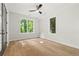Bedroom with hardwood floors and bright windows at 2461 Fernleaf Nw Ct, Atlanta, GA 30318