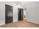 Bedroom boasts modern dark doors to storage or closets and an ensuite bathroom at 2461 Fernleaf Nw Ct, Atlanta, GA 30318
