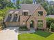 Charming brick home with a well-manicured lawn and a two-car garage at 2461 Fernleaf Nw Ct, Atlanta, GA 30318