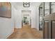 Inviting foyer with light herringbone wood floors and views into living areas at 2461 Fernleaf Nw Ct, Atlanta, GA 30318