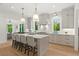 Modern kitchen with stainless steel appliances, white cabinets, and marble countertops at 2461 Fernleaf Nw Ct, Atlanta, GA 30318