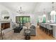 Open-concept living area with fireplace, hardwood floors, and seamless flow to the kitchen at 2461 Fernleaf Nw Ct, Atlanta, GA 30318