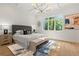 Comfortable main bedroom features wood floors, natural light, and luxury decorative details at 2461 Fernleaf Nw Ct, Atlanta, GA 30318