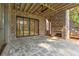 Covered patio with stone floors and a brick fireplace perfect for entertaining at 2461 Fernleaf Nw Ct, Atlanta, GA 30318