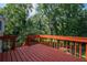 Inviting wooden deck overlooks the lush greenery of the backyard, ideal for outdoor entertaining at 3381 Birchwood Trl, Snellville, GA 30078