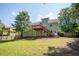 Expansive backyard view featuring green lawn and elevated deck, perfect for outdoor entertaining at 3381 Birchwood Trl, Snellville, GA 30078