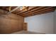 Unfinished basement with exposed wood ceiling and concrete floor, ready for customization at 3381 Birchwood Trl, Snellville, GA 30078