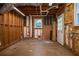 Unfinished basement featuring exposed framing and a door for easy outdoor access at 3381 Birchwood Trl, Snellville, GA 30078