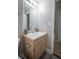 Bathroom featuring a sink with cabinet and large mirror at 3381 Birchwood Trl, Snellville, GA 30078