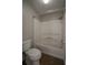 Bright bathroom showcasing a shower and tub combination with modern fixtures at 3381 Birchwood Trl, Snellville, GA 30078