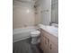 Bathroom with tub and sink with cabinet at 3381 Birchwood Trl, Snellville, GA 30078
