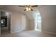 Neutrally painted bedroom with carpet, ceiling fan, closet, and window at 3381 Birchwood Trl, Snellville, GA 30078