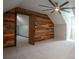 Bedroom featuring carpet, wooden accent wall, ceiling fan and ensuite bathroom at 3381 Birchwood Trl, Snellville, GA 30078