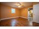Bedrom featuring wood floors, ceiling fan, and window that provides natural light at 3381 Birchwood Trl, Snellville, GA 30078