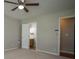 Comfortable bedroom with carpeted floor, closet, and attached bathroom at 3381 Birchwood Trl, Snellville, GA 30078