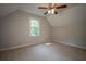 Bedroom featuring neutral paint, carpet, and a window providing outdoor views at 3381 Birchwood Trl, Snellville, GA 30078