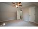 Neutral bedroom with ceiling fan includes carpet and closet space at 3381 Birchwood Trl, Snellville, GA 30078