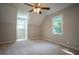 Spacious bedroom provides neutral paint, carpet, and lots of natural light at 3381 Birchwood Trl, Snellville, GA 30078