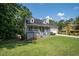Quaint home with a welcoming front porch, shutters, a lush lawn, and an attached two-car garage at 3381 Birchwood Trl, Snellville, GA 30078