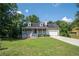 Beautiful home with a spacious front yard, covered porch, and attached garage at 3381 Birchwood Trl, Snellville, GA 30078