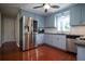 Charming kitchen features stainless steel appliances, stone countertops, and abundant cabinet space at 3381 Birchwood Trl, Snellville, GA 30078