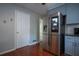Open kitchen features stainless steel appliances, stone countertops, and adjacent access to dining area at 3381 Birchwood Trl, Snellville, GA 30078