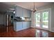 Open-concept dining with views of the kitchen and back deck at 3381 Birchwood Trl, Snellville, GA 30078