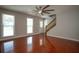 Sunlit living room showcasing wood floors and staircase at 3381 Birchwood Trl, Snellville, GA 30078