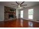 Living room featuring a stone fireplace and wood floors at 3381 Birchwood Trl, Snellville, GA 30078