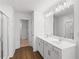 Bathroom boasts a glass shower, double vanity, and sleek fixtures at 1119 Lockhart Way, Douglasville, GA 30135