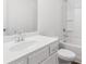 Clean bathroom featuring a shower-tub combo, single sink vanity and tiled floors at 1119 Lockhart Way, Douglasville, GA 30135