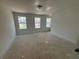 Spacious bedroom with three large windows, providing ample natural light at 1119 Lockhart Way, Douglasville, GA 30135