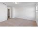 This bedroom has neutral carpet and white walls at 1119 Lockhart Way, Douglasville, GA 30135