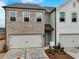 Attached garages, and various exterior finishes at 1119 Lockhart Way, Douglasville, GA 30135