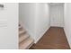 Home entrance with hardwood floors and staircase access to the upper level at 1119 Lockhart Way, Douglasville, GA 30135