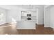 Modern kitchen with stainless steel appliances, white cabinets, and hardwood floors at 1119 Lockhart Way, Douglasville, GA 30135