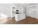 Bright kitchen features stainless appliances, stylish pendants, and tile backsplash at 1119 Lockhart Way, Douglasville, GA 30135