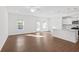 Open concept living space with natural light and access to the kitchen and backyard at 1119 Lockhart Way, Douglasville, GA 30135