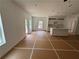 Bright living room features an open floor plan into the kitchen with modern white cabinets at 1119 Lockhart Way, Douglasville, GA 30135