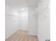 Spacious walk-in closet with carpeted floors and wire shelving for optimal storage at 1119 Lockhart Way, Douglasville, GA 30135