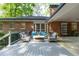Spacious deck with outdoor seating, ideal for entertaining guests. Brick house in background at 1342 Old Johnson Ferry Ne Rd, Brookhaven, GA 30319