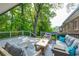 Cozy deck with patio furniture and a view of lush greenery, perfect for relaxing outdoors at 1342 Old Johnson Ferry Ne Rd, Brookhaven, GA 30319