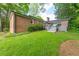 Lush backyard with a well-maintained lawn and a view of the home's deck at 1342 Old Johnson Ferry Ne Rd, Brookhaven, GA 30319