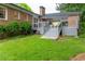 Spacious backyard featuring a well-maintained lawn and a charming back deck at 1342 Old Johnson Ferry Ne Rd, Brookhaven, GA 30319