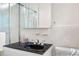 Bathroom featuring a walk-in shower with updated fixtures, a mirror, and a vessel sink at 1342 Old Johnson Ferry Ne Rd, Brookhaven, GA 30319