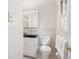 Cozy bathroom featuring a black countertop, white fixtures, and a window at 1342 Old Johnson Ferry Ne Rd, Brookhaven, GA 30319