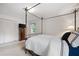 Bright bedroom featuring a decorative four-poster bed and a closet with louvered doors at 1342 Old Johnson Ferry Ne Rd, Brookhaven, GA 30319
