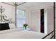 Bedroom with a four-poster bed with closet access and bright natural light at 1342 Old Johnson Ferry Ne Rd, Brookhaven, GA 30319